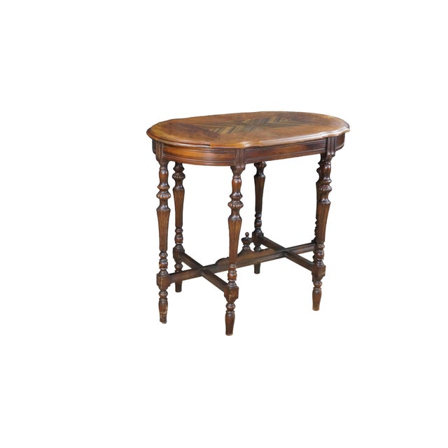 This 1930s-1940s Mersman parlor table features a distinctive scalloped, serpentine "turtle-top" design crafted from rich...