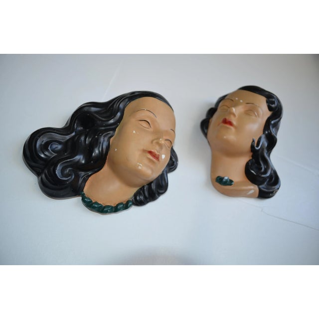 Pair of mid century terra cotta women's faces wall masks/art. In the style of Goldscheider/Prischi. Art Deco vanity masks.