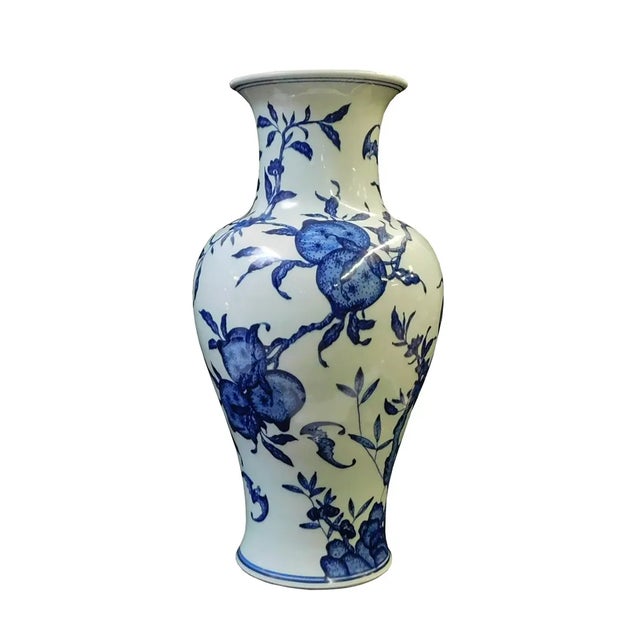 This elegant blue and white porcelain vase embodies the timeless beauty of traditional Chinese ceramics, showcasing a...