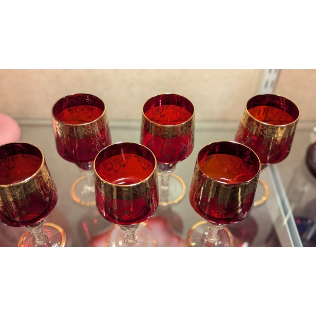 Beautiful set of six ruby red glasses with clear twisted stems and gold overlay, I believe these are Italian made. Quality...