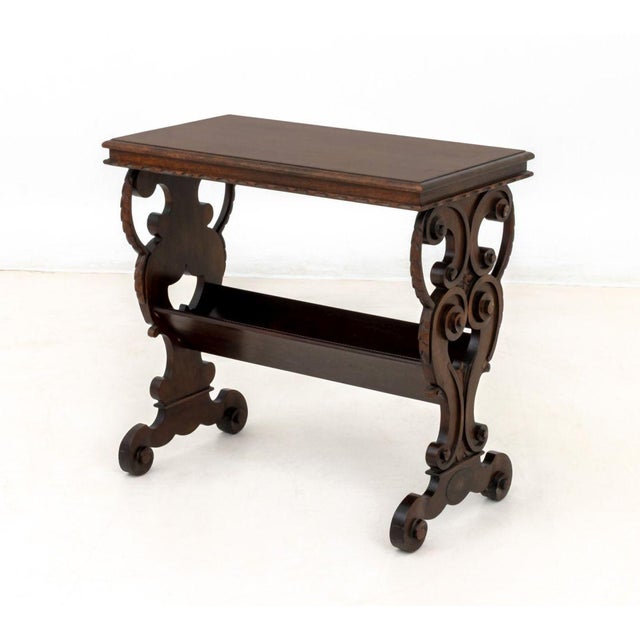Renaissance Style Mahogany Side Table, with two carved supports conjoined by a canterbury undertier, Flint &amp; Horner...