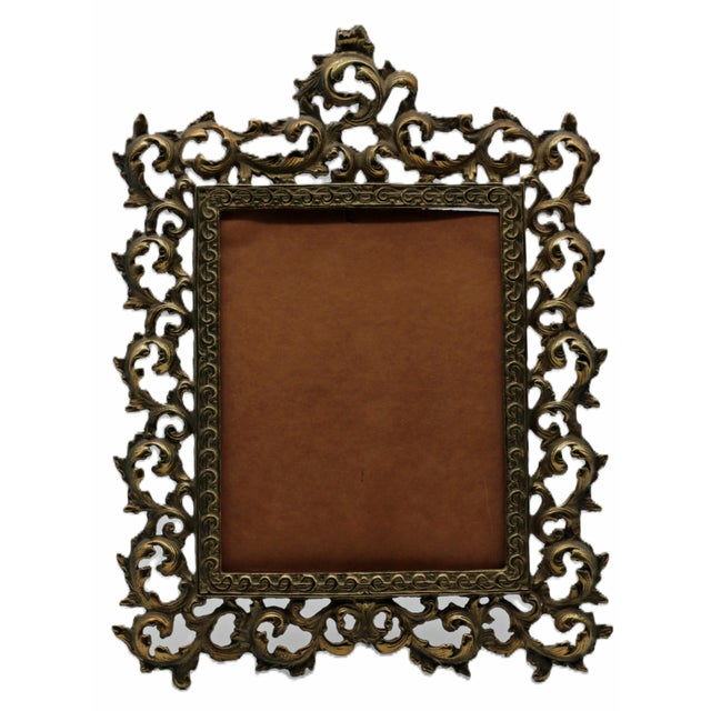 Summary Large cast‑brass picture frame featuring dramatic pierced acanthus and scrolling foliage in the Rococo Revival...