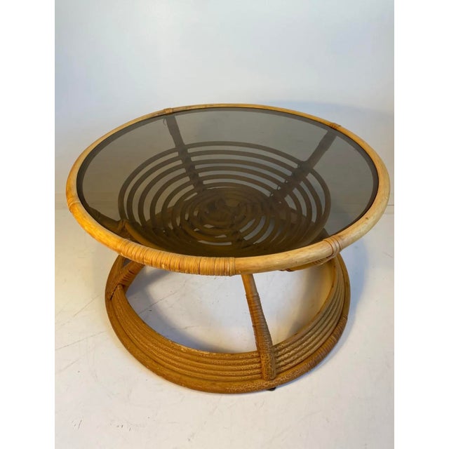 Beautiful bamboo coffee table from the 1970s Colored, integrated glass top Fixed/non-removable Diameter: 60 cm Height: 43...