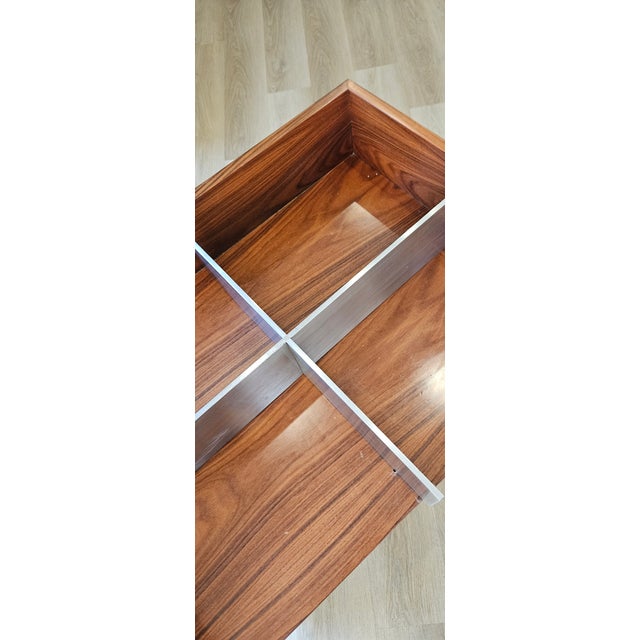 Philippe Starck is a famous French designer. Cruciform wardrobe made of brushed steel slats on a rolling base, created for...