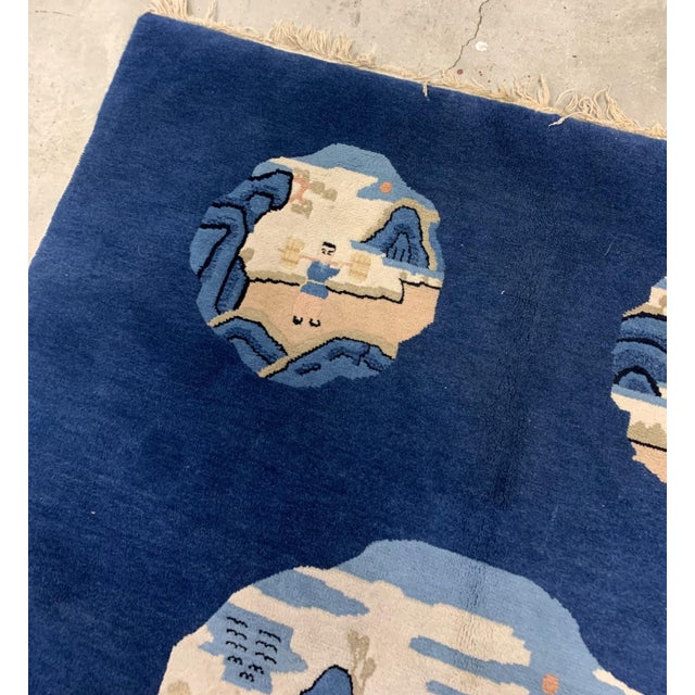 Handmade antique Peking Chinese rug in blue color and pictorial design. The rug is from the beginning of 20th century in...