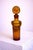 A rare and highly sculptural amber glass decanter designed by Erik Höglund for Boda Glasbruk in the 1950s, exemplifying...