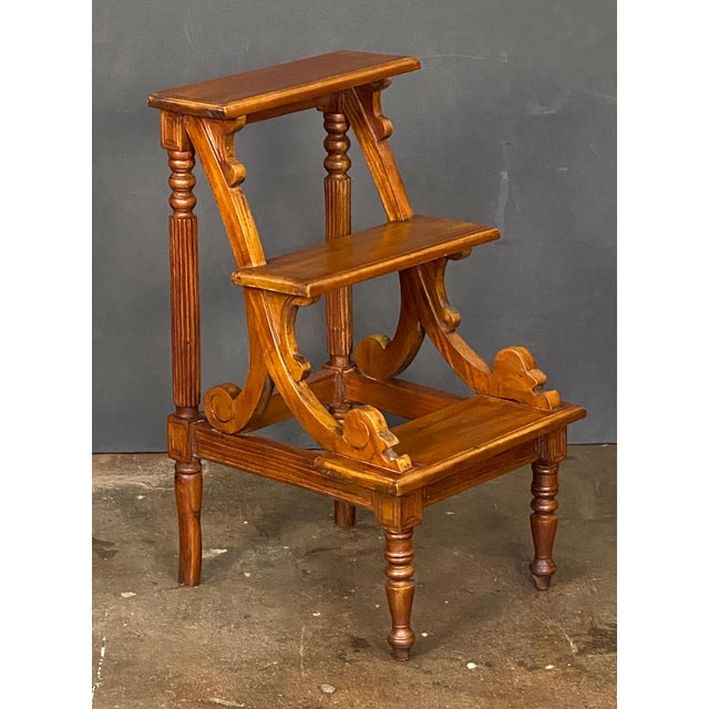 A fine English library three-step stool, also known as library stairs or a library ladder, crafted from solid mahogany...