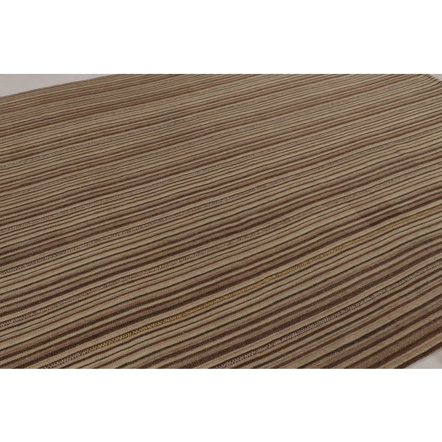 Made with handwoven wool in Persia 1950-1960, this 9x10 vintage Bidjar Kilim is a particularly earthy and sought-after...