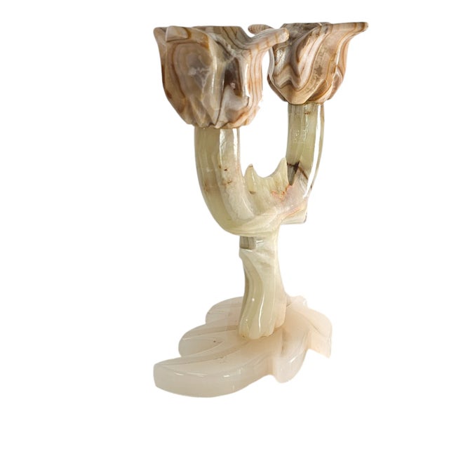 This lovely onyx candlestick is all hand carved. Their design is a testament to the artistry of the carvers, reflecting a...