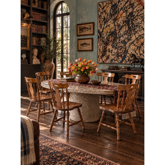 A refined set of six vintage dining chairs in the Colonial Revival tradition, distinguished by graceful proportions and...