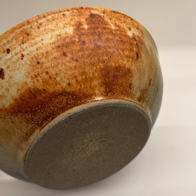 This serving bowl is a one-of-a-kind artisan piece, making it not just a dish, but a piece of art for your home. Signed by...