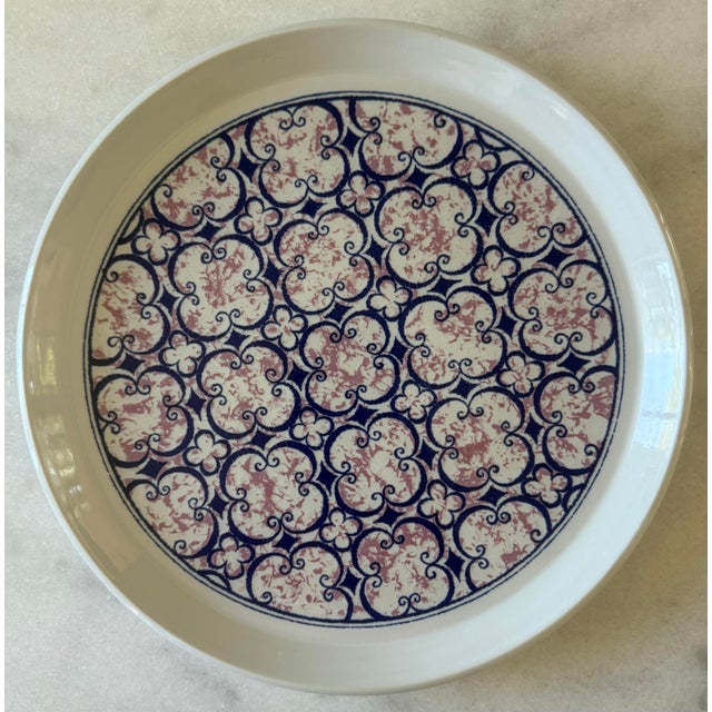 Set of 7 vintage stoneware dinner plates made by Noritake Primastone in the pink and blue "Image" pattern. Produced from...