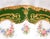 This is a Jean Pouyat Limoges plate in white with a green outer band, a swag of multicolor flowers and gold trim. The...