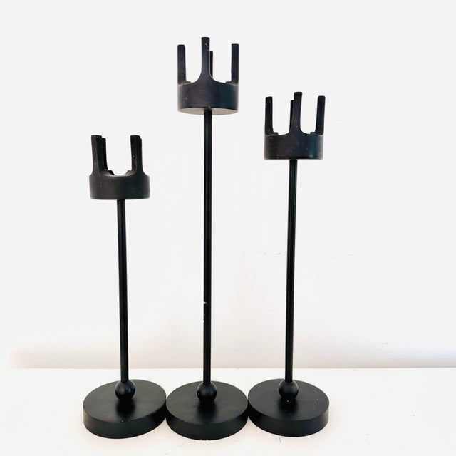 Set of three mid-century cast iron candle holders that have been attributed to Van Keppel-Green, California. Made of heavy...