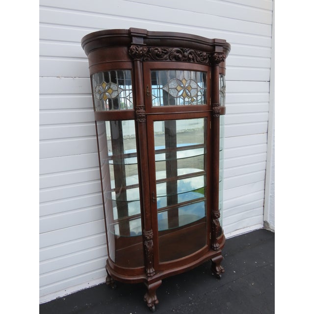 This beautiful Antique Curio Cabinet is made of wood, solid wood, solid oak, tiger oak, veneer, and glass. This cabinet...