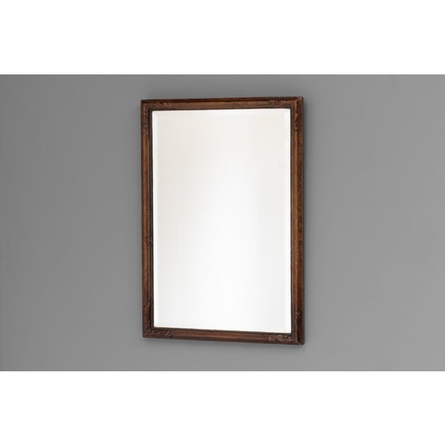 Small decorative Victorian mirror. Carved pine frame and heavy patinaed lacquered finish. U.K circa 1870.