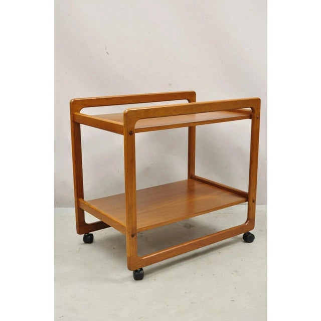 Vintage Mid Century Danish Modern Teak 2 Tier Rolling Bar Cart Serving Side Table. Circa Late 20th Century. Measurements:...