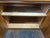 Mid-Century Modern teak cabinet crafted in Denmark. The front features two seamlessly matched teak doors that showcase...