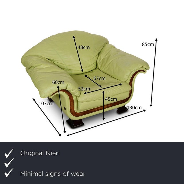 The Divani armchair by Nieri is covered in green leather and stands on round wooden feet. The elegant wood applications...