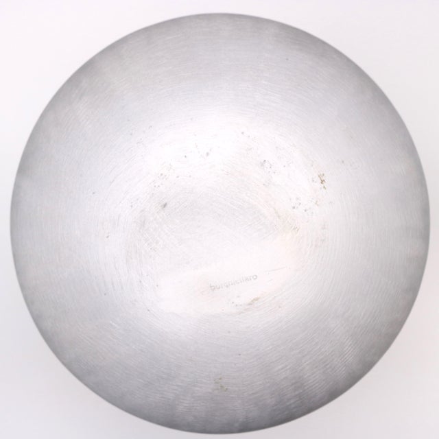 A sculptural Modernist round vase by artist Lorenzo Burchiellaro. Textured cast aluminum. Signed underneath Burchiellaro.