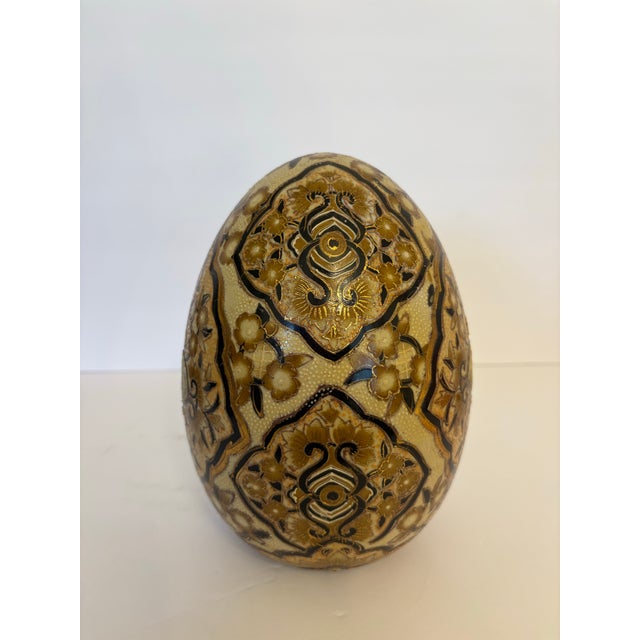 Beautifully hand painted and gold gilded this Satsuma style egg sculpture is exquisite. It was made in the 1960's in China...