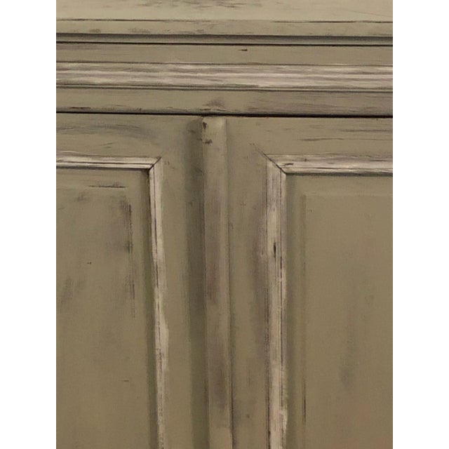 Sturdy naively painted sideboard has old hardware and plenty of storage. This could also be stripped to reveal the...