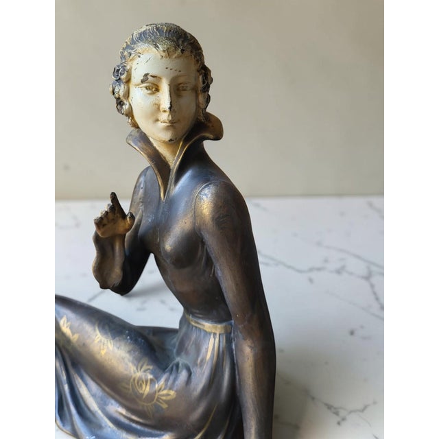 Art Deco sculpture, "Woman and Her Dog," circa 1930. Height 27 cm Dimensions 14 x 45 cm Made of spelter with a silver and...