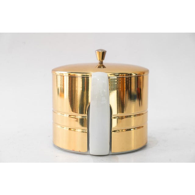 The ceramic lid has a small chip. ( see last photo ) Brass polished and stove enameled