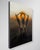 Ascend presents a figure emerging from a dark, abstract landscape, with hands raised and an intense light radiating from...