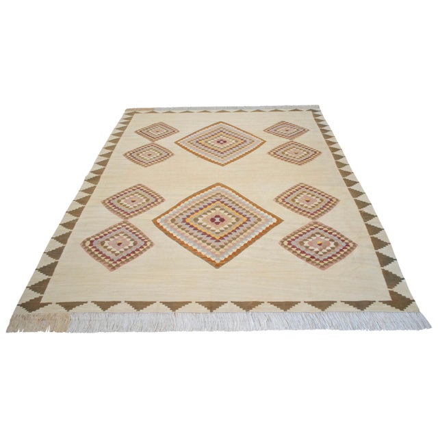 Hand-woven in the 2020s in the historic weaving center of Oushak, Aegean Anatolia, this exquisite one-of-a-kind flatweave...