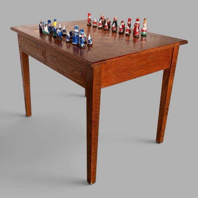 A characterful vintage French oak games table with an integrated chessboard and useful storage drawer. Its versatile...