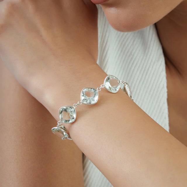 Crafted in 925 sterling silver, this bracelet features 38.62 carats of green amethyst (prasiolite) in cushion-cut...