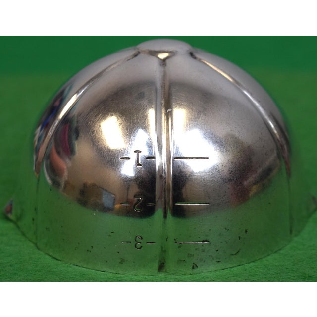 Sz: 1 3/4" H x 3"W x 3 1/2"D The Napier Silver-Plated Jockey Cap Jigger is a highly collectible piece of early 20th-...