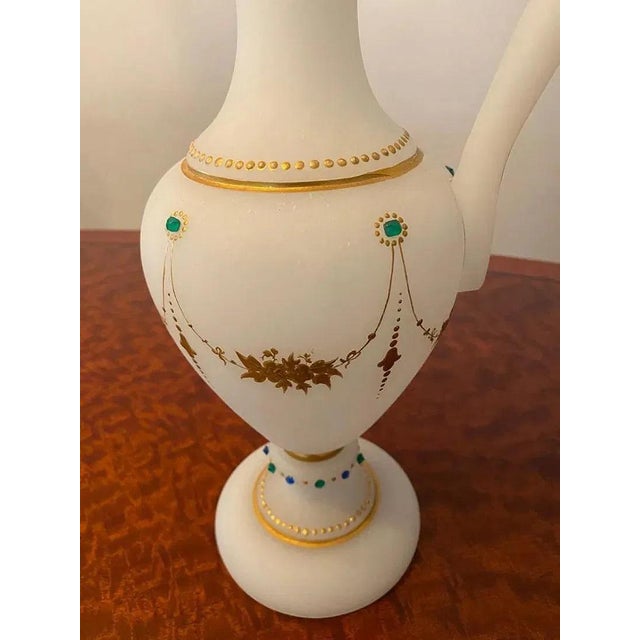 Extremely fine European antique glass pitcher with raised gold leaf and green precious stones. Late 19th century....