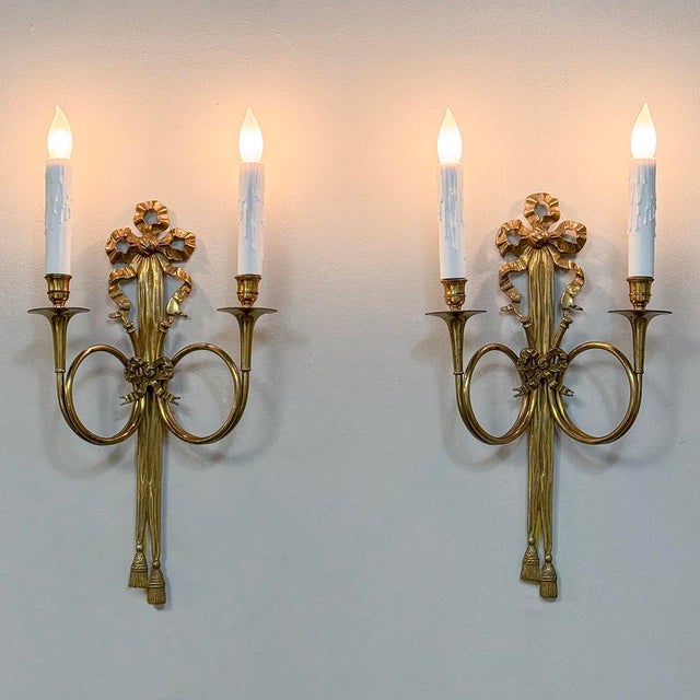 Pair Antique French Louis XVI Neoclassical Cast Brass Wall Sconces are the ideal choice for creating a special visual...
