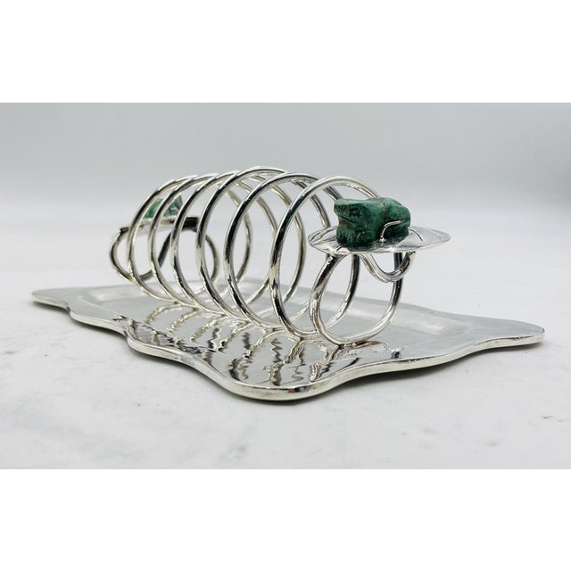 Charming and sculptural desk organizer designed by renowned Taxco silversmith Emilia Castillo, handcrafted in silver plate...