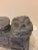 Wonderful pair of foo dogs is hand-carved out of solid stone. Details of lotus flowers can be observed on their saddles. A...