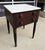 This 19th-century end table features a solid marble top set above a two-drawer wooden base, retaining its original,...