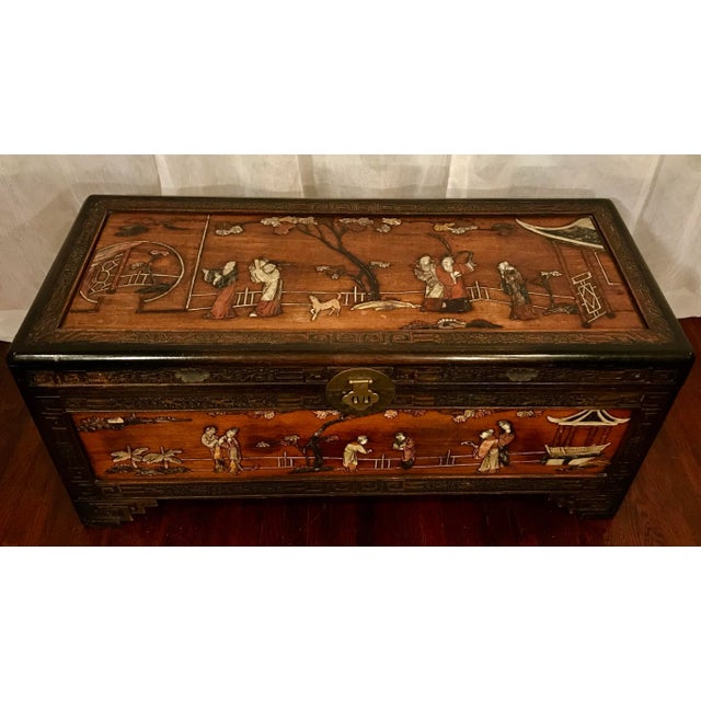 Antique Chinese inlaid stone, camphor wood, carved trunk. It’s easy to say that photos truly do not do justice to the...