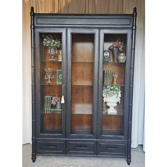 Gorgeous Display Cabinet , Faux Bamboo cabinet dated from 1950s Mid Century Modern/ Eclectic Style. An imponent display...