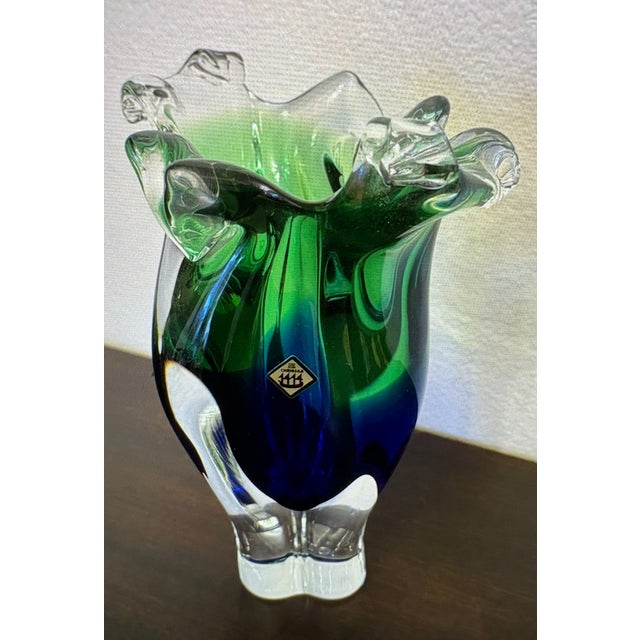 The colors of the blue and green are so vivid in this vase, it is indeed a heavy art blown glass piece of Chrisbka Josef...