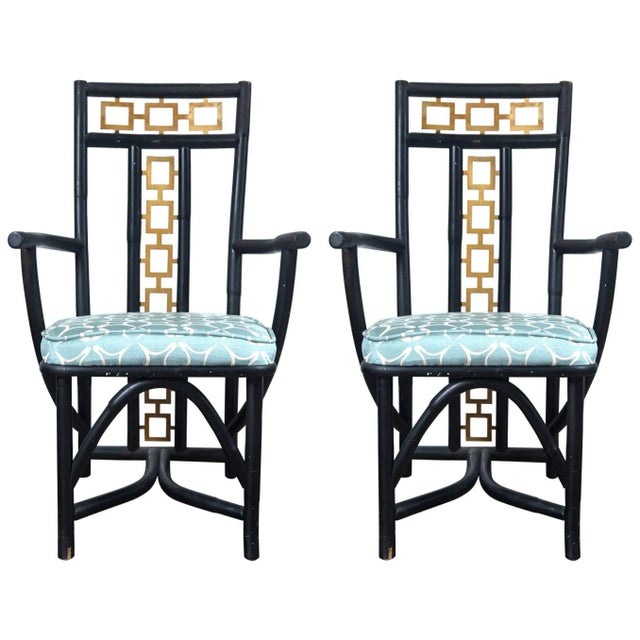 Very stylish James Mont type Asian armchairs. Muscular wood frames with gilt metal geometric fretwork incorporated into...