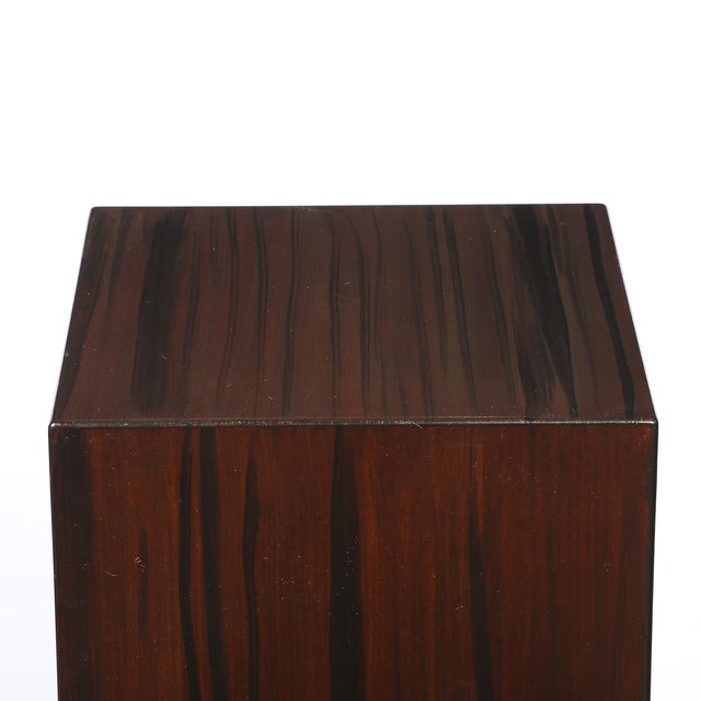 This pair of Art Deco rectilinear rosewood pedestals, crafted in France circa 1940, showcases the elegant, streamlined...