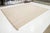 This flatweave natural rug features a contemporary Dhurrie design, characterized by a tan beige base color and stylish...