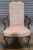 Chairs feature a high back flanked by gooseneck arms, balloon seat, raised on carved mahogany cabriole legs with carved...