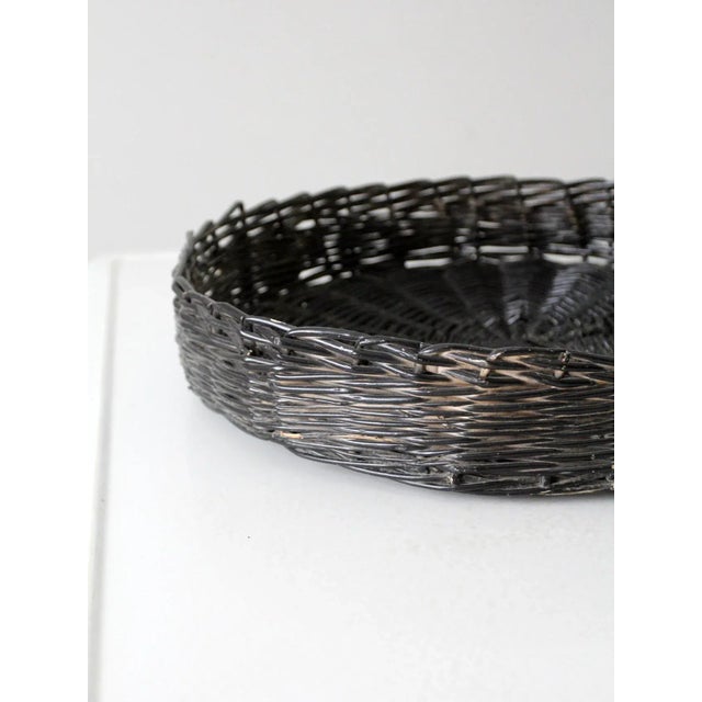 This vintage black wicker basket tray is an ideal centerpiece for any table. Its natural woven texture and large size...
