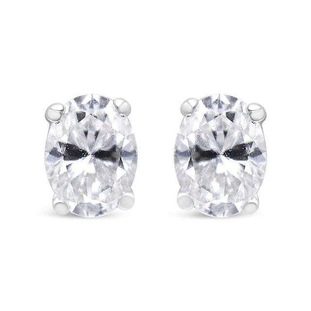 Add a touch of shine to your everyday look with these beautifully classic 1/2 cttw diamond solitaire earrings. These studs...