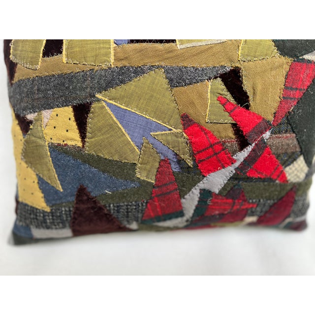 This is a pillow upholstered with a patchwork. An artisanal masterpiece for the curated home. The size is 16 X 13 X 5...