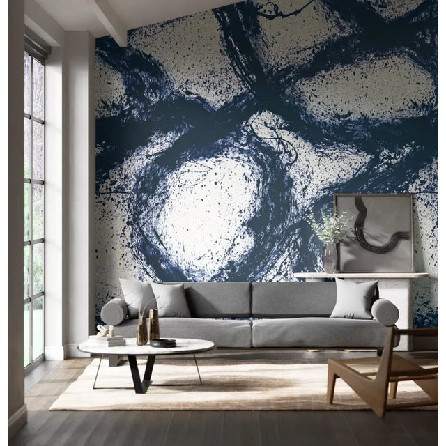 Alive with free-flowing movement and created outdoors by an expressive hand abstract markings twist and turn on a ground...
