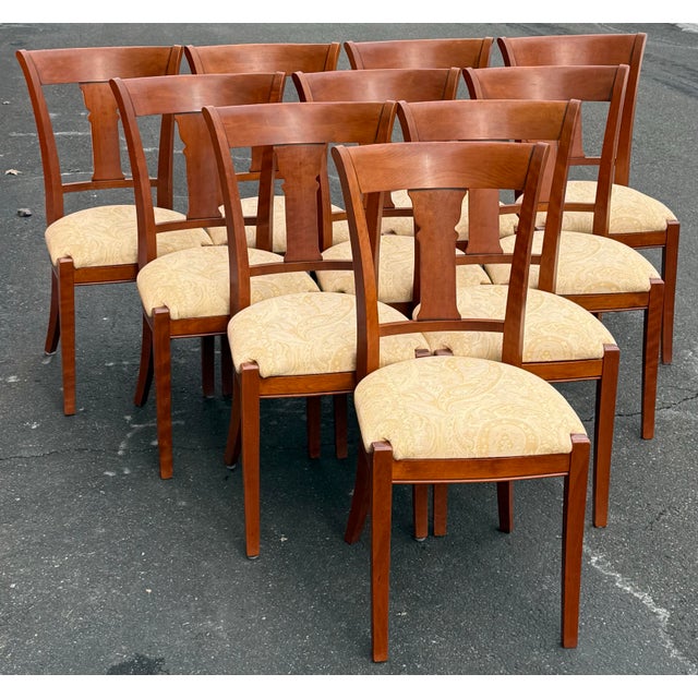 Very hard to find set of 10 dining chairs by Grange. . Each chair features fiddle like shaped back splat and standing on...